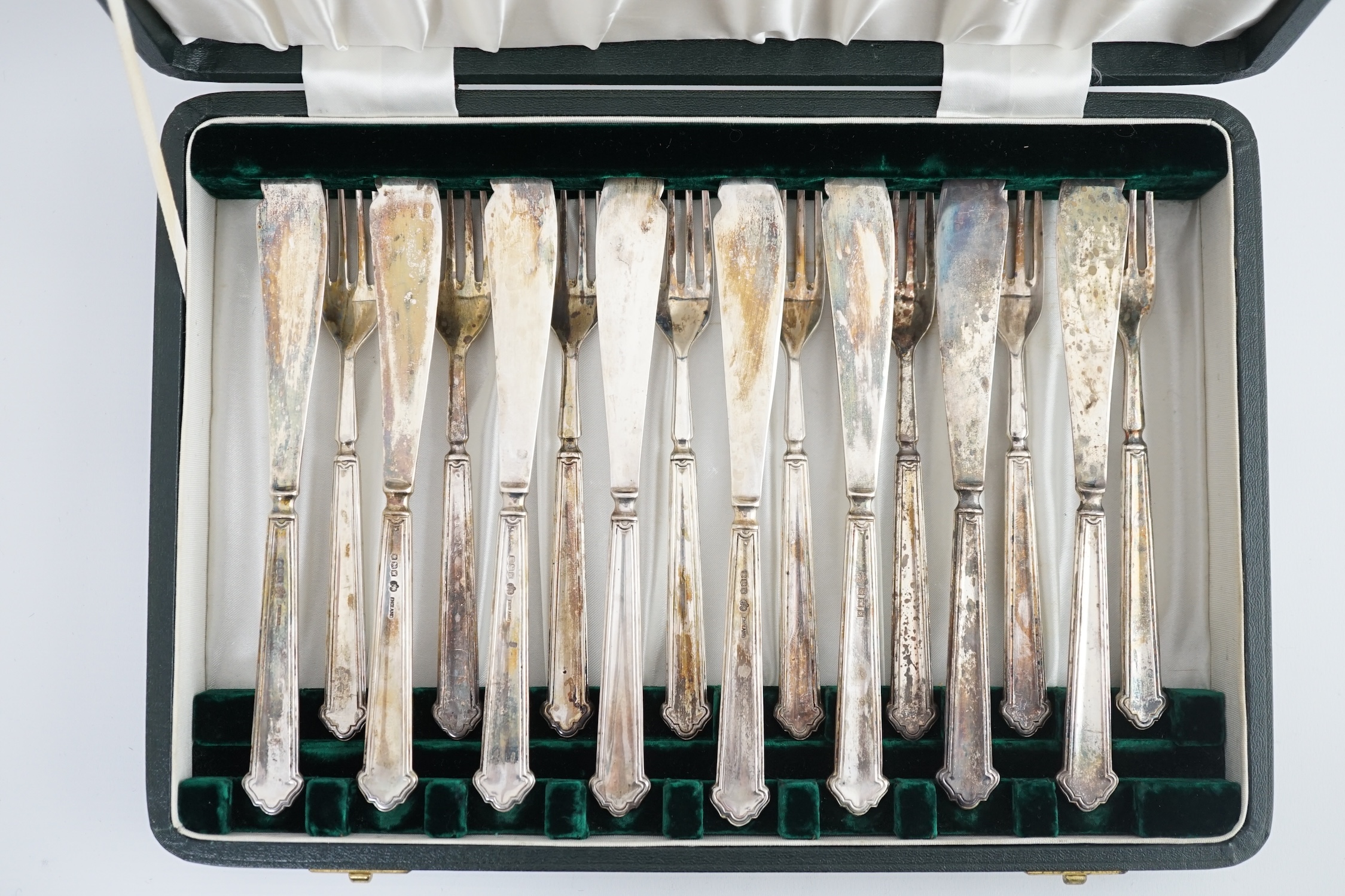 Twelve pairs of solid silver fish eaters, by Elkington & Co